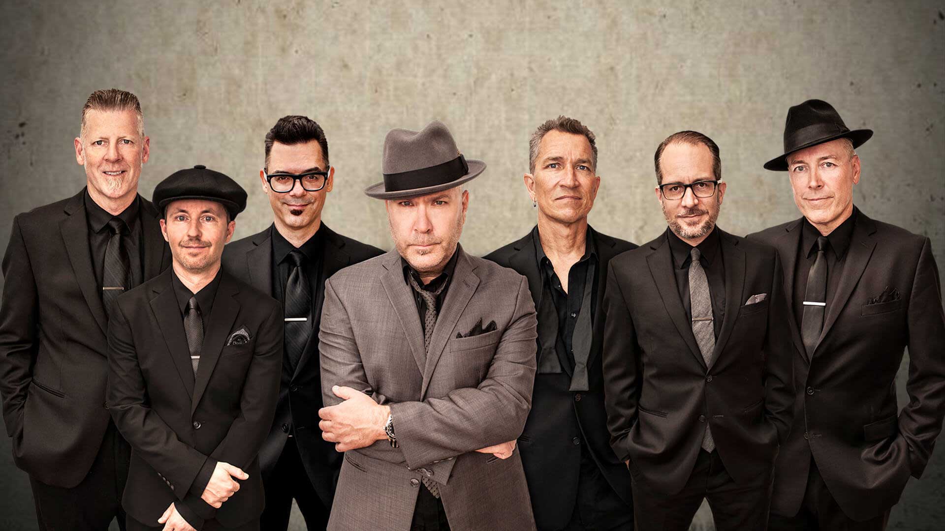 Dressed in suits and fedoras, seven members of Big Bad Voodoo Daddy prepare to unleash big band sound at the Paramount.